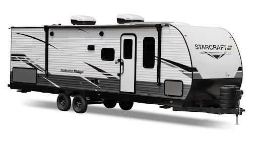 unnamed (12) A white and black Starcraft Autumn Ridge travel trailer with two axles, rooftop air units, multiple windows, and a side entrance door.