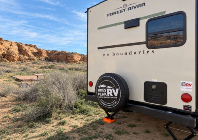 NOBO Camper in with red mountains behind them