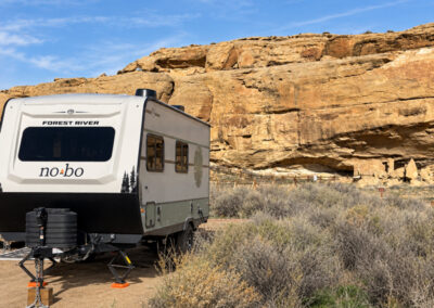 NOBO Camper in with red mountains behind them