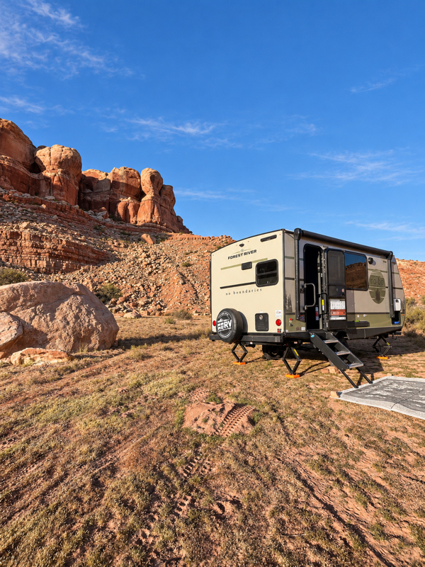NOBO Camper in with red mountains behind them