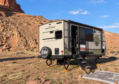NOBO Camper in with red mountains behind them